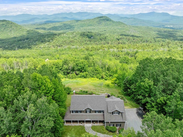 15 Glade Cir, Campton, NH 03223 - aerial view of property and surrounding area featuring a heavily wooded area and a mountainous background