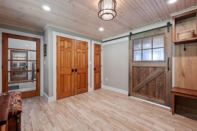 15 Glade Cir, Campton, NH 03223 - foyer entrance featuring a barn door, crown molding, recessed lighting, wood finished floors, and wood ceiling