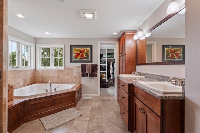 15 Glade Cir, Campton, NH 03223 - full bathroom featuring double vanity, a bath, recessed lighting, and a walk in closet