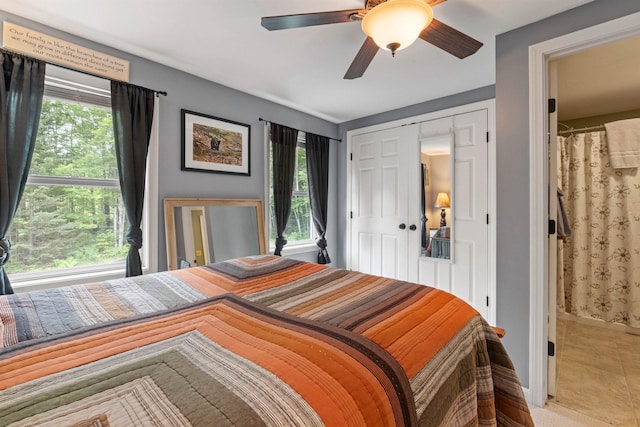 15 Glade Cir, Campton, NH 03223 - tiled bedroom featuring multiple windows, a ceiling fan, and a closet