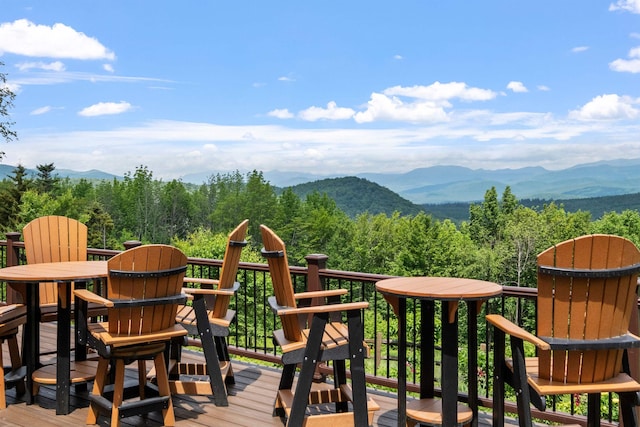 15 Glade Cir, Campton, NH 03223 - deck featuring a mountain view, outdoor dining area, and a view of trees