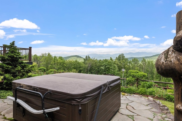 15 Glade Cir, Campton, NH 03223 - view of patio / terrace with a hot tub, a mountain view, and a wooded view