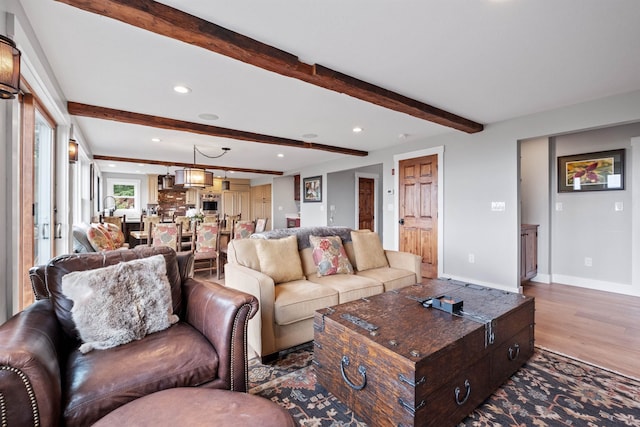 15 Glade Cir, Campton, NH 03223 - living area with wood finished floors, beam ceiling, and recessed lighting