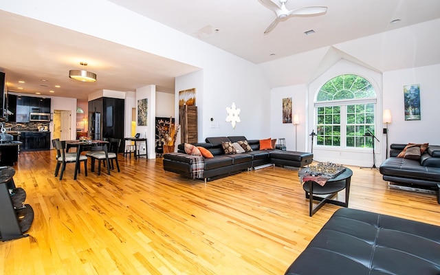 53 Lollypop Ln, Danville, NH 03819 - living room featuring light wood-type flooring, lofted ceiling, and a ceiling fan