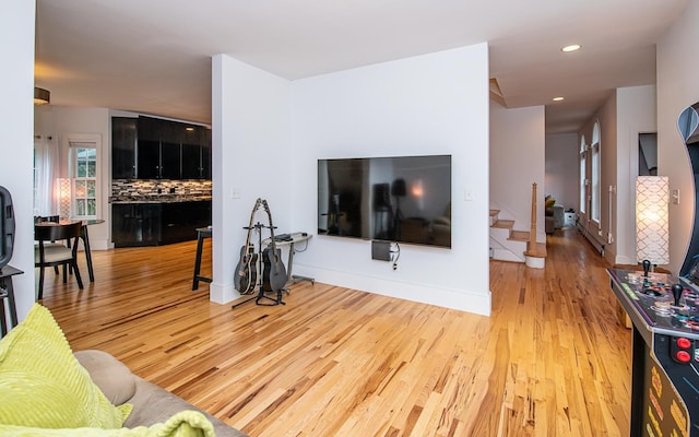 53 Lollypop Ln, Danville, NH 03819 - living area with wood finished floors, stairs, and recessed lighting