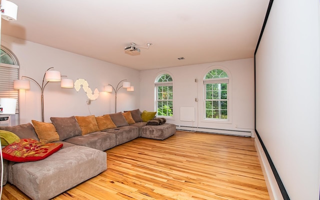 53 Lollypop Ln, Danville, NH 03819 - living area featuring a baseboard heating unit and wood finished floors