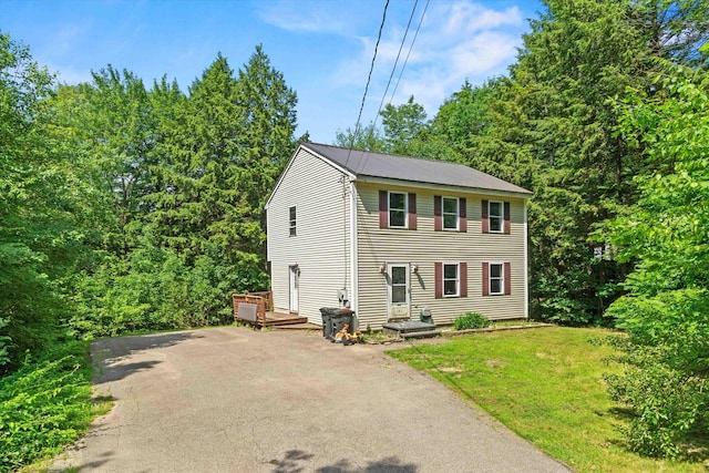 141 Jefferson Dr, Hillsborough, NH 03244 - colonial-style house featuring driveway