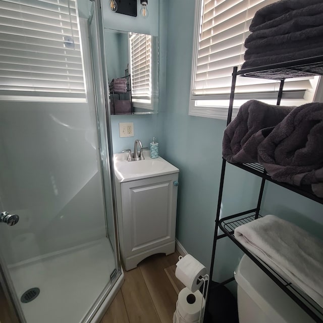 14 Johnson Ave Unit A, Hampton, NH 03842 - bathroom with a shower stall, wood finished floors, and vanity