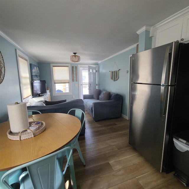 14 Johnson Ave Unit A, Hampton, NH 03842 - dining space featuring crown molding and dark wood-style floors