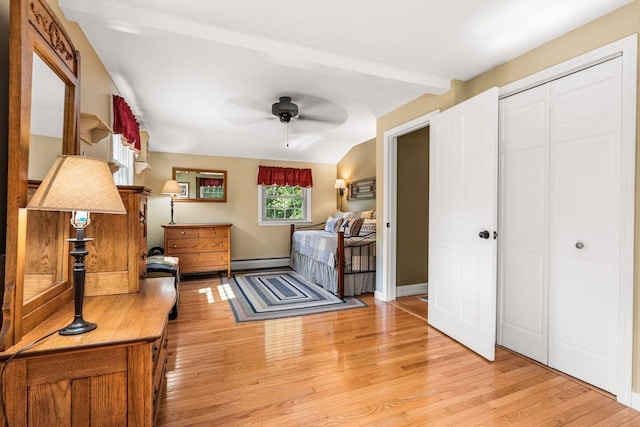 9 Jade Rd, Merrimack, NH 03054 - living area with a baseboard heating unit, a ceiling fan, and light wood-style flooring