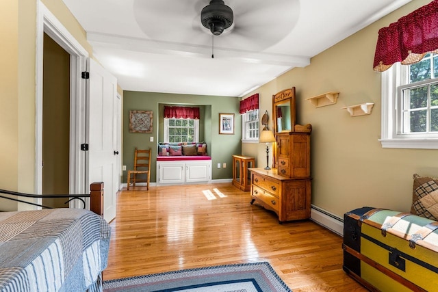 9 Jade Rd, Merrimack, NH 03054 - bedroom with a baseboard radiator, light wood finished floors, and a ceiling fan