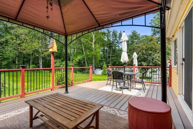 9 Jade Rd, Merrimack, NH 03054 - wooden terrace with outdoor dining space, a lawn, and view of scattered trees