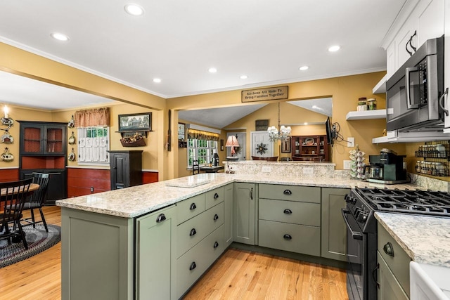 9 Jade Rd, Merrimack, NH 03054 - kitchen featuring stainless steel microwave, healthy amount of natural light, black range with gas stovetop, a peninsula, and crown molding
