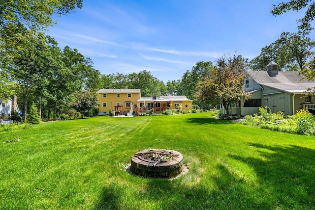 9 Jade Rd, Merrimack, NH 03054 - view of green lawn featuring an outdoor fire pit