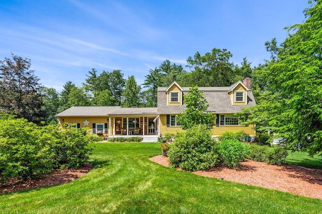 9 Jade Rd, Merrimack, NH 03054 - view of front of property with a chimney, a front lawn, and covered porch