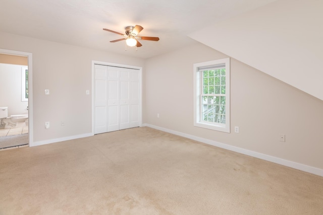 5 Golf Vw Unit B, Laconia, NH 03246 - unfurnished bedroom featuring light carpet, a closet, a ceiling fan, and vaulted ceiling