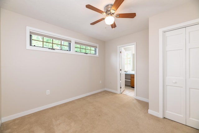 5 Golf Vw Unit B, Laconia, NH 03246 - unfurnished bedroom with light colored carpet, a closet, connected bathroom, and a ceiling fan