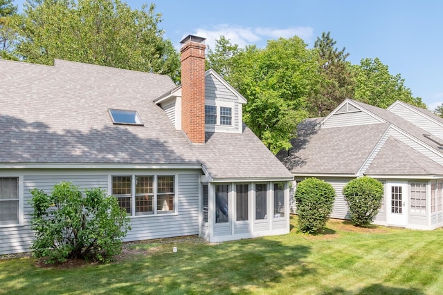 5 Golf Vw Unit B, Laconia, NH 03246 - back of property with a chimney, a shingled roof, a lawn, and a sunroom