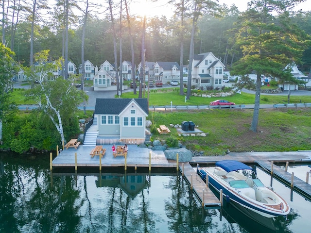 109 Weirs Blvd Unit 9, Laconia, NH 03246 - dock featuring a yard, a water view, a residential view, and an outdoor fire pit