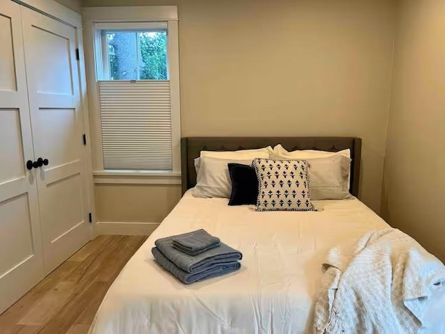 109 Weirs Blvd Unit 9, Laconia, NH 03246 - bedroom with wood finished floors and a closet