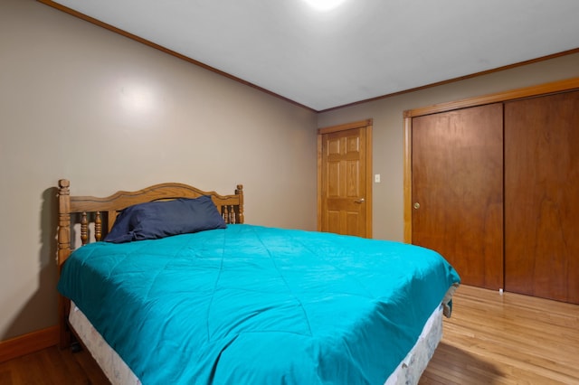 13 Seyah Rd, Shelburne, NH 03581 - bedroom featuring wood finished floors, ornamental molding, and a closet