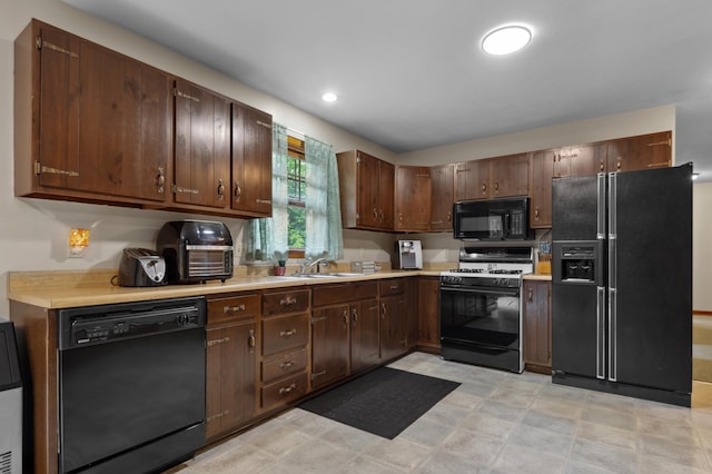 13 Seyah Rd, Shelburne, NH 03581 - kitchen featuring black appliances, light countertops, and dark brown cabinetry