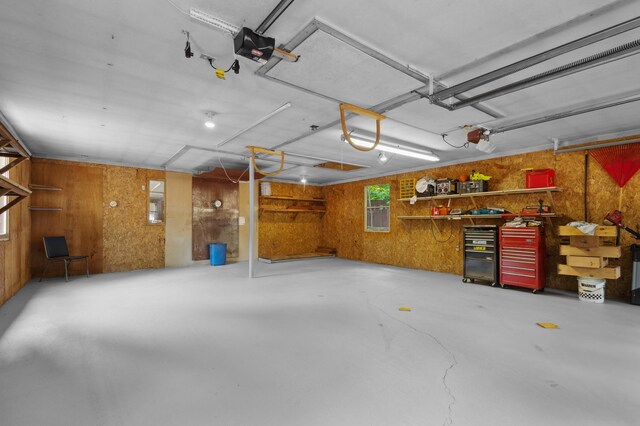 13 Seyah Rd, Shelburne, NH 03581 - garage featuring a garage door opener and wooden walls