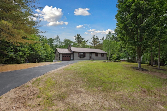 13 Seyah Rd, Shelburne, NH 03581 - single story home featuring driveway, a garage, a chimney, and a front yard