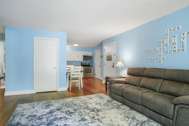 2 Autumn Leaf Dr Unit 20, Nashua, NH 03060 - living room with dark wood-style flooring and baseboards