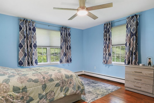 2 Autumn Leaf Dr Unit 20, Nashua, NH 03060 - bedroom with a baseboard radiator, multiple windows, wood finished floors, and a ceiling fan
