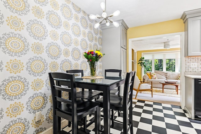 27 Olde Common Dr, Atkinson, NH 03811 - dining space with a chandelier, tile patterned floors, and wallpapered walls