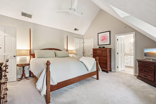 27 Olde Common Dr, Atkinson, NH 03811 - bedroom featuring a skylight, light carpet, lofted ceiling, ensuite bath, and a ceiling fan