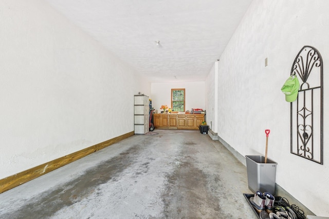 27 Olde Common Dr, Atkinson, NH 03811 - garage featuring baseboards