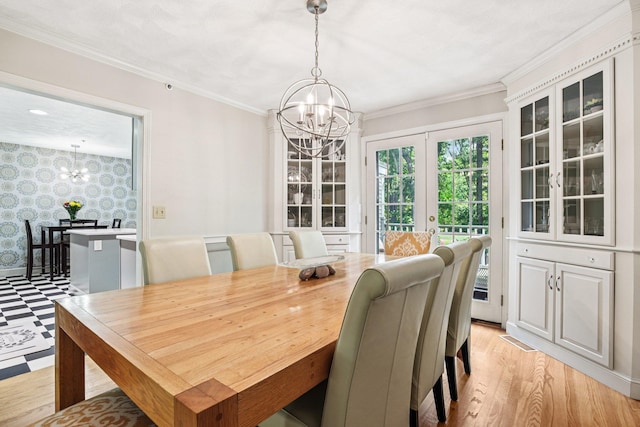 27 Olde Common Dr, Atkinson, NH 03811 - dining area featuring a chandelier, ornamental molding, light wood-style flooring, and wallpapered walls