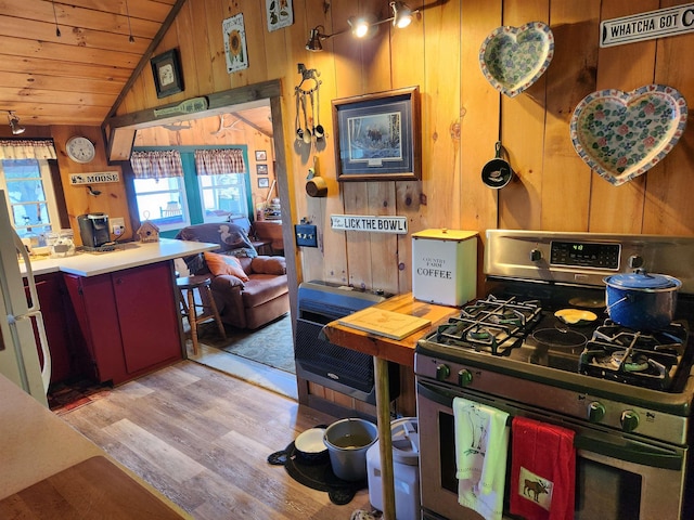 106 Nanas Ln, Concord, VT 05824 - kitchen with gas range, wooden ceiling, vaulted ceiling, wood finished floors, and wooden walls