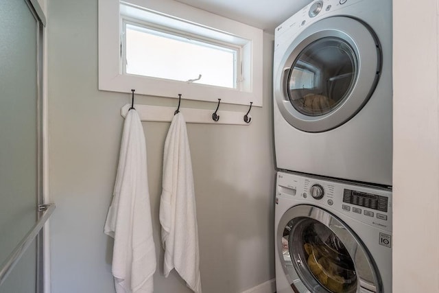 49 Mason Rd, Brookline, NH 03033 - washroom with stacked washer / dryer and baseboards