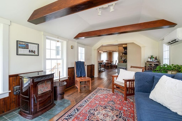 49 Mason Rd, Brookline, NH 03033 - living area with a wainscoted wall, a wall unit AC, dark wood-type flooring, wood walls, and a chandelier
