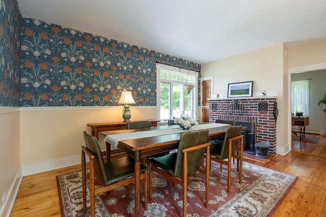 49 Mason Rd, Brookline, NH 03033 - dining room featuring hardwood / wood-style flooring, a fireplace, and wallpapered walls