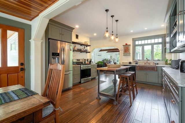 49 Mason Rd, Brookline, NH 03033 - kitchen featuring stainless steel appliances, gray cabinets, open shelves, arched walkways, and recessed lighting