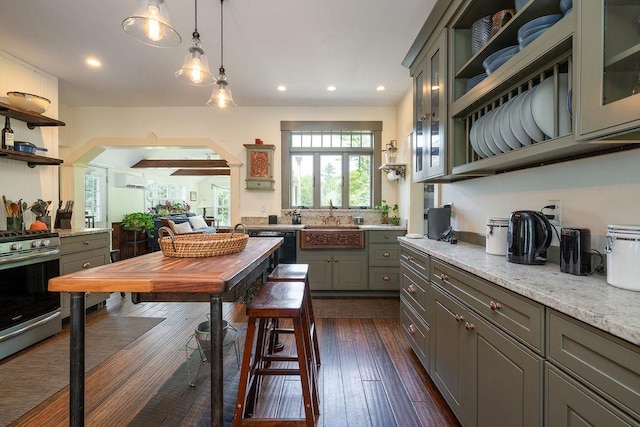 49 Mason Rd, Brookline, NH 03033 - kitchen with open shelves, stainless steel gas stove, recessed lighting, gray cabinets, and decorative light fixtures