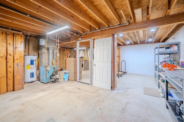 15 Prospect St, Farmington, NH 03835 - unfinished basement featuring electric water heater and washing machine and clothes dryer