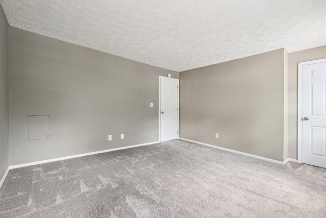 272 Winding Pond Rd Unit 272, Londonderry, NH 03053 - carpeted empty room featuring a textured ceiling and baseboards
