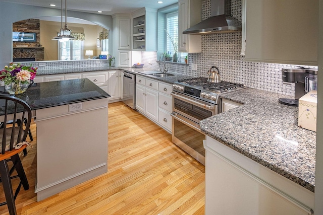 1 Sonia Dr, Dover, NH 03820 - kitchen with wall chimney exhaust hood, stainless steel appliances, plenty of natural light, light wood finished floors, and recessed lighting