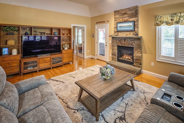 1 Sonia Dr, Dover, NH 03820 - living room featuring a fireplace, light wood-style flooring, and vaulted ceiling