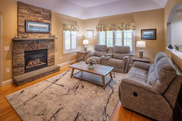 1 Sonia Dr, Dover, NH 03820 - living area featuring a fireplace, wood finished floors, and arched walkways