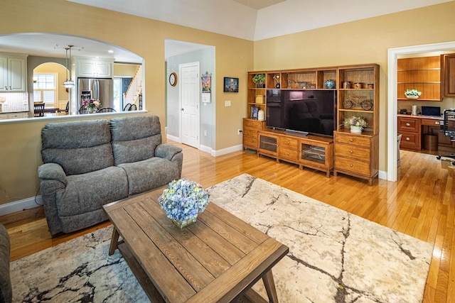 1 Sonia Dr, Dover, NH 03820 - living room featuring arched walkways, light wood finished floors, and a desk