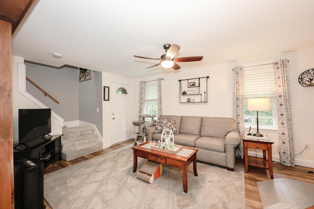 2L Homestead Dr Unit L, Derry, NH 03038 - living area with stairs, a ceiling fan, and light wood-style flooring