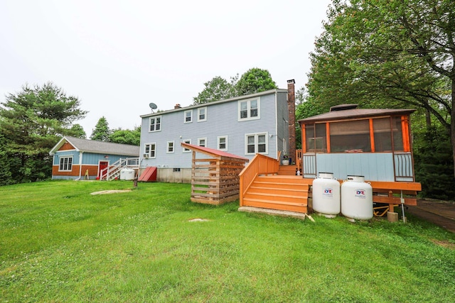 2L Homestead Dr Unit L, Derry, NH 03038 - back of property with a sunroom, a deck, and a yard