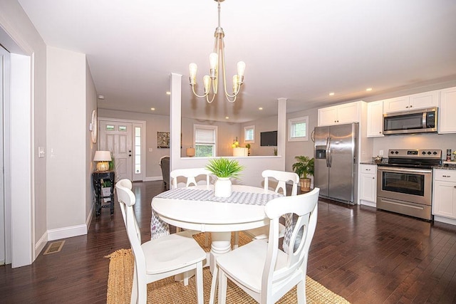 9 Marshall Rd, Kingston, NH 03848 - dining room featuring dark wood-type flooring, recessed lighting, and a chandelier