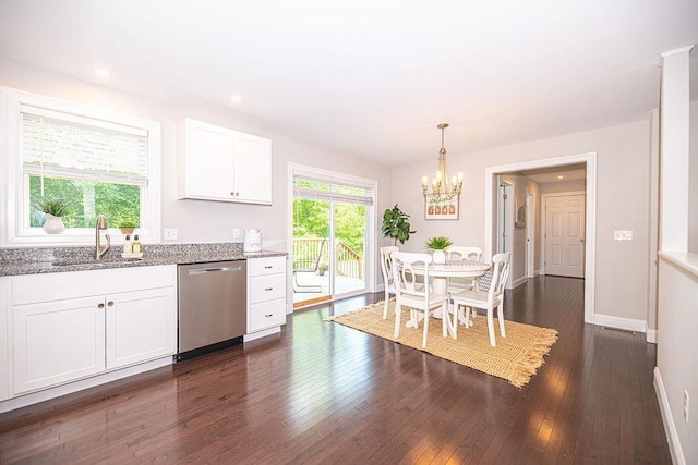 9 Marshall Rd, Kingston, NH 03848 - kitchen with stainless steel dishwasher, light stone countertops, white cabinets, a chandelier, and dark wood finished floors